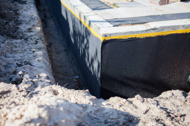 Professional Waterproofing technician working in Riverview, MI